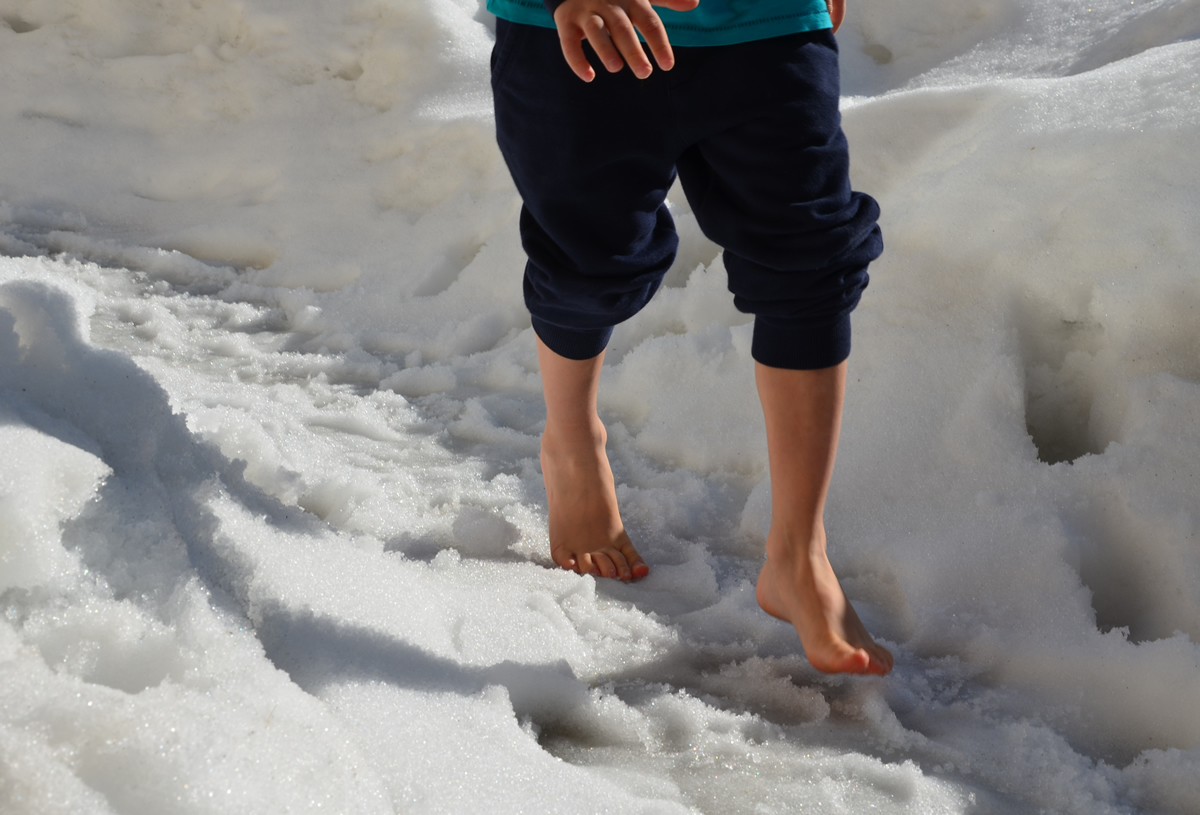 Boy barefoot in Winter